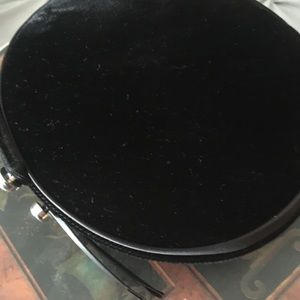 Pillbox hat, black, decorative buttons.